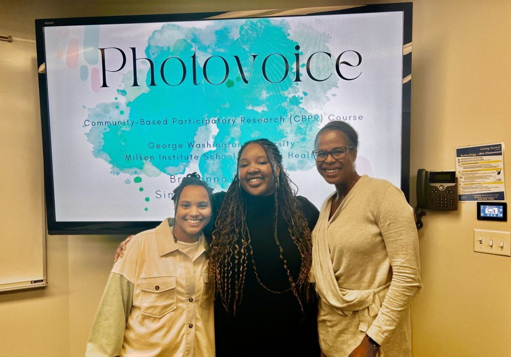 Simone Sawyer (center), alongside mentee Breyanna Dabney (left) and Dr. Tamara Taggart (right), during their Photovoice lecture in Dr. Taggart’s Community-Based Participatory Research course